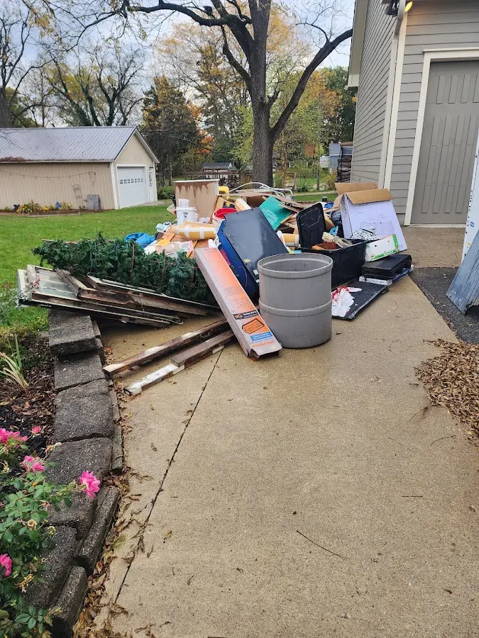 Dumpster being loaded with debris for 12 Yard Dumpster Rental in Silverthorne
